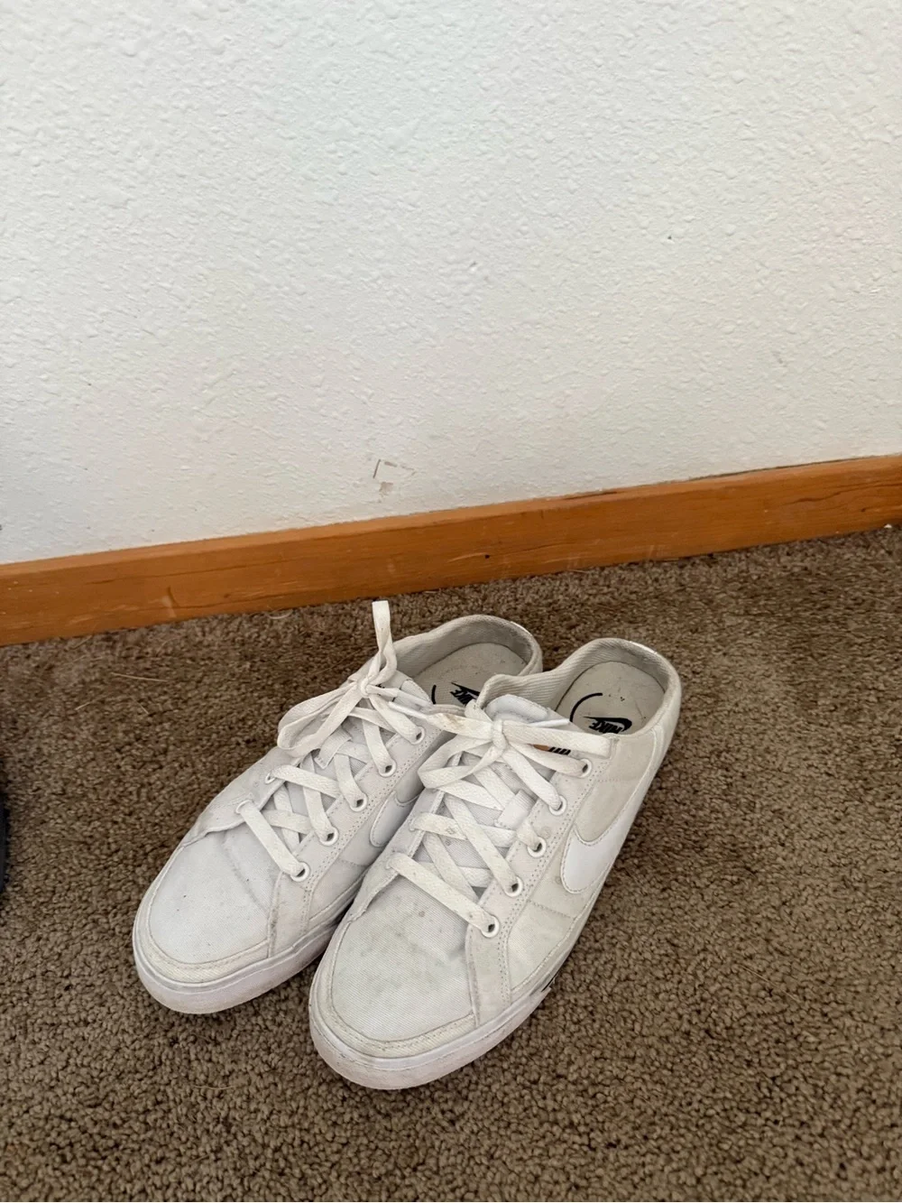 Nike Women’s White Canvas slip-on Sneakers